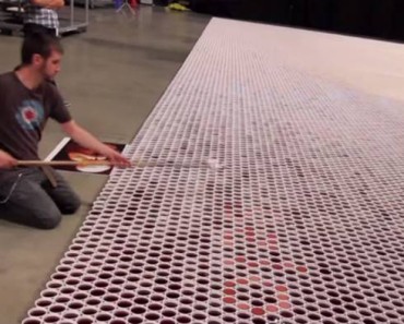 He Lines Up 66,000 Cups Filled With Water 1 By 1. When The Camera Zooms Out, THIS Is Revealed. OMG!