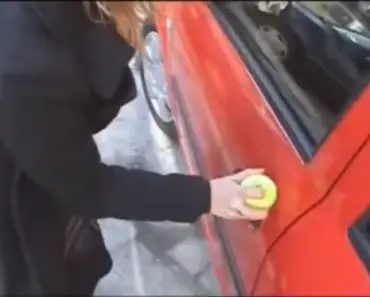 She Got Locked Out Of Her Car, So She Put A Tennis Ball Over The Keyhole. GENIUS!