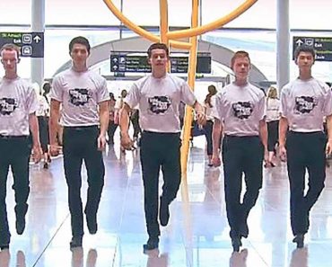 Boys line up in formation, surprise people at airport with an epic flash mob performance