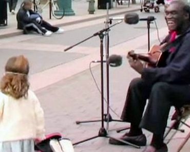 Keep Your Eye On the Little Girl as Street Performer Starts Playing a Classic