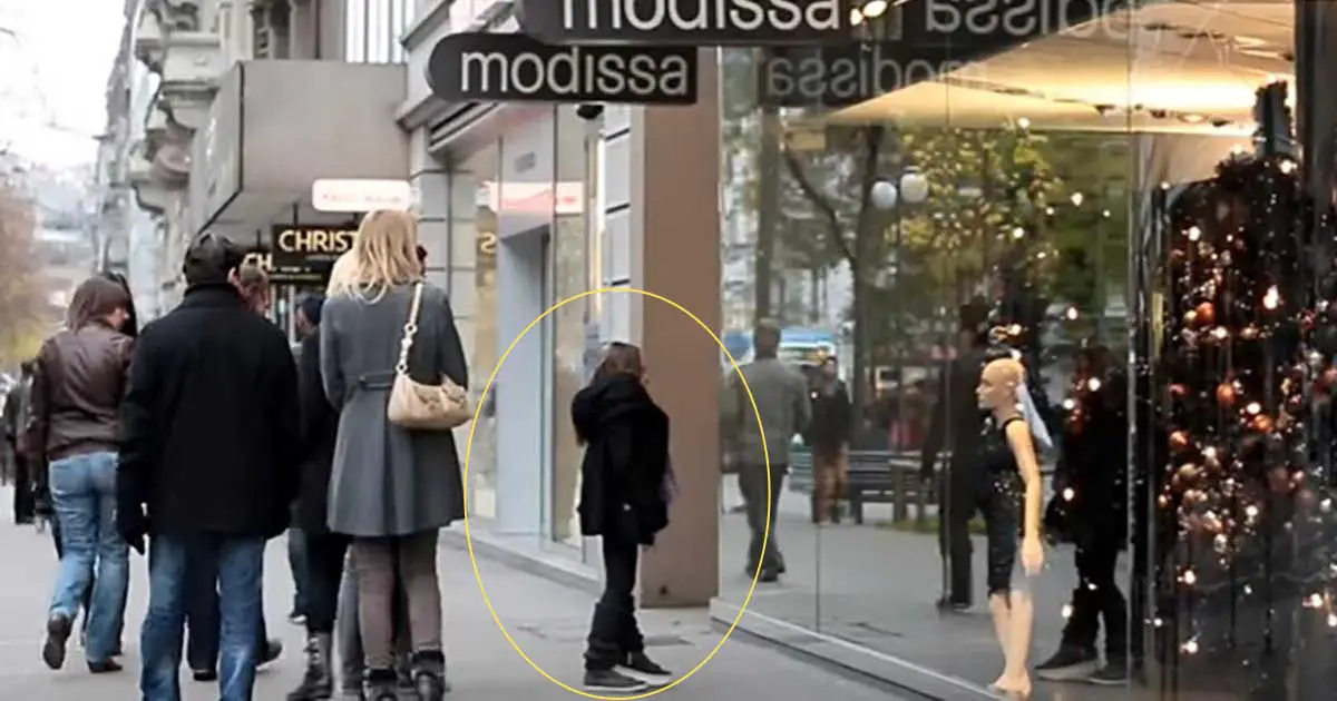 Woman Spots Mannequin Of Herself In Window, Looks Around And Struggles To Hold Back Tears